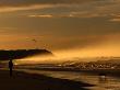 Seaspray, A Man And His Dog And Another Day Ends At 13Th Beach At Barwon Heads by Bernard Napthine Limited Edition Print