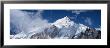 Sagarmatha National Park, Nuptse, Low Angle View Of Clouds Around Snow Covered Mountains, Nepal by Panoramic Images Limited Edition Print