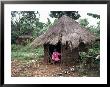 Little Girl Dressed For Church, In Front Of Hut, Uganda, East Africa, Africa by D H Webster Limited Edition Print
