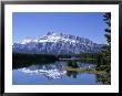 Snowy Peak Of Mount Rundle Reflected In The Water Of Two Jack Lake, Banff National Park, Alberta by Pearl Bucknall Limited Edition Print