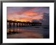 Pier At Sunrise With Reflections Of Clouds On Beach, Tybee Island, Georgia, Usa by Joanne Wells Limited Edition Print