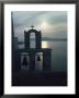 A Bell Tower Silhouetted Against The Sea Of Crete At Sunset by Anne Keiser Limited Edition Print