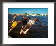 Young Boys Dive Off Marina At Bay Of Belize With City In Background, Belize City, Belize by Anthony Plummer Limited Edition Print