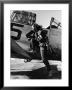 Female Pilot Of The Us Women's Air Force Service Posed With Her Leg Up On The Wing Of An Airplane by Peter Stackpole Limited Edition Print
