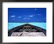 Small Fishing Boat (Dhoni) In The Crystal Clear Waters Off The Maldives, Maldives by Dennis Wisken Limited Edition Print