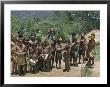 Portrait Of A Huli Man And Group Of Children Highlands, Papua New Guinea by Sybil Sassoon Limited Edition Print