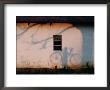 Shadow On A Wall Of A Man Holding A Bicycle by Chris Johns Limited Edition Print