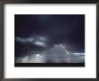 Shot Of A Thunderstorm With An Arc Of Lightning At Right by Kenneth Garrett Limited Edition Print