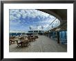 Tables And Chairs On The Pool Deck Of A Cruise Ship by Todd Gipstein Limited Edition Print