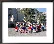 Girls In Traditional Local Dress Dancing In Square At Yanque Village, Colca Canyon, Peru by Tony Waltham Limited Edition Print