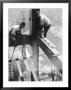 Workers Balancing On Steel Beam Above Streets During Construction Of The Manhattan Company Building by Arthur Gerlach Limited Edition Print