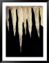 Illuminated Icicles Hang In Front Of A Dark Background by Todd Gipstein Limited Edition Print