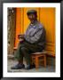 Man Sitting On Stool On Sidewalk, Looking At Camera, Baisha, China by Kraig Lieb Limited Edition Pricing Art Print