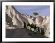 A Turkish Family And Their Donkey Climbing Cappadocia Rock Formations by Jonathan Blair Limited Edition Print