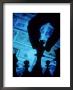 Hand Holding Chess Piece In Front Of Currency by Gary Conner Limited Edition Pricing Art Print