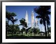 Petronas Twin Towers Seen From Public Park, Kuala Lumpur, Malaysia, Southeast Asia by Charcrit Boonsom Limited Edition Pricing Art Print