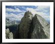 A Climber Standing At The Top Of A Mountain In The Dolomites, Italy by Ed George Limited Edition Print