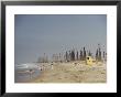 Beach Scene With Oil Rigs In The Background by Joseph Baylor Roberts Limited Edition Print