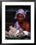 Female Spice Vendor At Market, Looking At Camera, Yamoussoukro, Cote D'ivoire by Pershouse Craig Limited Edition Print