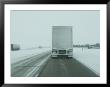 Trucks Roll Over An Icy Interstate 80 Near Lincoln, Nebraska by Joel Sartore Limited Edition Pricing Art Print