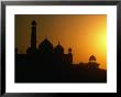 Domes And Minarets Of Mosque In Taj Mahal Gardens Silhoutted At Sunset, Agra, Uttar Pradesh, India by Richard I'anson Limited Edition Print