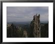 A Climber Stands Atop Khyyam Spire In South Dakota by Bobby Model Limited Edition Pricing Art Print