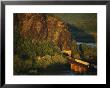 A Train Enters A Tunnel From A Railroad Bridge Over The Potomac River by Joel Sartore Limited Edition Pricing Art Print