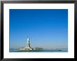 A Frontal View Of The Statue Of Liberty And Ellis Island by Norbert Rosing Limited Edition Print