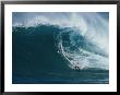 A Surfer Rides A Powerful Wave Off The North Shore Of Maui Island by Patrick Mcfeeley Limited Edition Print
