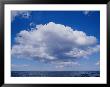 White, Fluffy Clouds Form Above The Water At Twofold Bay In Australia by Jason Edwards Limited Edition Print