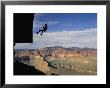 A Man Rappels Down A Cliff In Grand Canyon National Park by Bill Hatcher Limited Edition Print