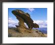 A Rock Formation Shaped By Wind Erosion Overlooks The Grand Canyon by Melissa Farlow Limited Edition Print
