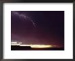 A Bolt Of Lightning Crosses A Stormy Sky by Bill Curtsinger Limited Edition Print