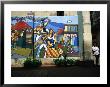 Woman Leaning Against A Wall With Mural In Old Havana, Havana, Cuba by Rick Gerharter Limited Edition Print