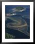Red Tides Swirl Around Islands In Southeast Alaska by Bill Curtsinger Limited Edition Print