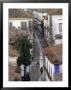 Woman In Narrow Alley With Whitewashed Houses, Obidos, Portugal by John & Lisa Merrill Limited Edition Print