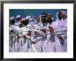 Men Performing Traditional Dance With Sticks, Abu Dhabi, United Arab Emirates by Chris Mellor Limited Edition Print