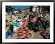 Traders Selling Hand Crafted Pottery At Market In San Pedro Village, Cuzco, Peru by Richard I'anson Limited Edition Print