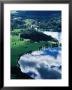 Cloud Reflecting In Eastern Lake Bohinj With Ribcev Laz In Background, Bohinj, Slovenia by Martin Moos Limited Edition Print