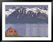 Small Farm Building With Mountains, Harstad, Norway by Walter Bibikow Limited Edition Print