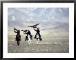 Eagle Hunters Dalai Khan, Takhuu Grandfather, Son Kook Kook, Golden Eagle Festival, Mongolia by Amos Nachoum Limited Edition Pricing Art Print