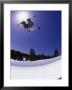 Airborne Snowboarder In Half Pipe Position by Kurt Olesek Limited Edition Print