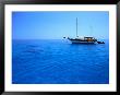 Yacht Anchored In Waters Of Gulf Of Orosei, Sardinia, Italy by Dallas Stribley Limited Edition Print