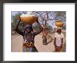 Women Returning With Water From Well, Niger by Oliver Strewe Limited Edition Print