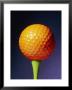An Orange Golf Ball On A Green Tee With A Blue Background by Brian Gordon Green Limited Edition Print