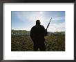 An Armed Guard Watches Over Inmates Working On A Chain Gang by Bill Curtsinger Limited Edition Print