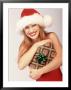 Woman In Santa Hat Holding Gift by Jim Mcguire Limited Edition Print