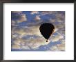 A Soaring Hot Air Balloon Against A Cloud-Filled Sky by Jason Edwards Limited Edition Print