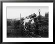 Two Children Stand On A Fence And Wave A Handkerchief At A Passing Steam Train by Staniland Pugh Limited Edition Pricing Art Print