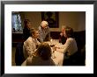 A Family Has A Fun Time Around A Table On Vacation, Fraueninsel, Chiemsee, Bavaria, Germany by Taylor S. Kennedy Limited Edition Print